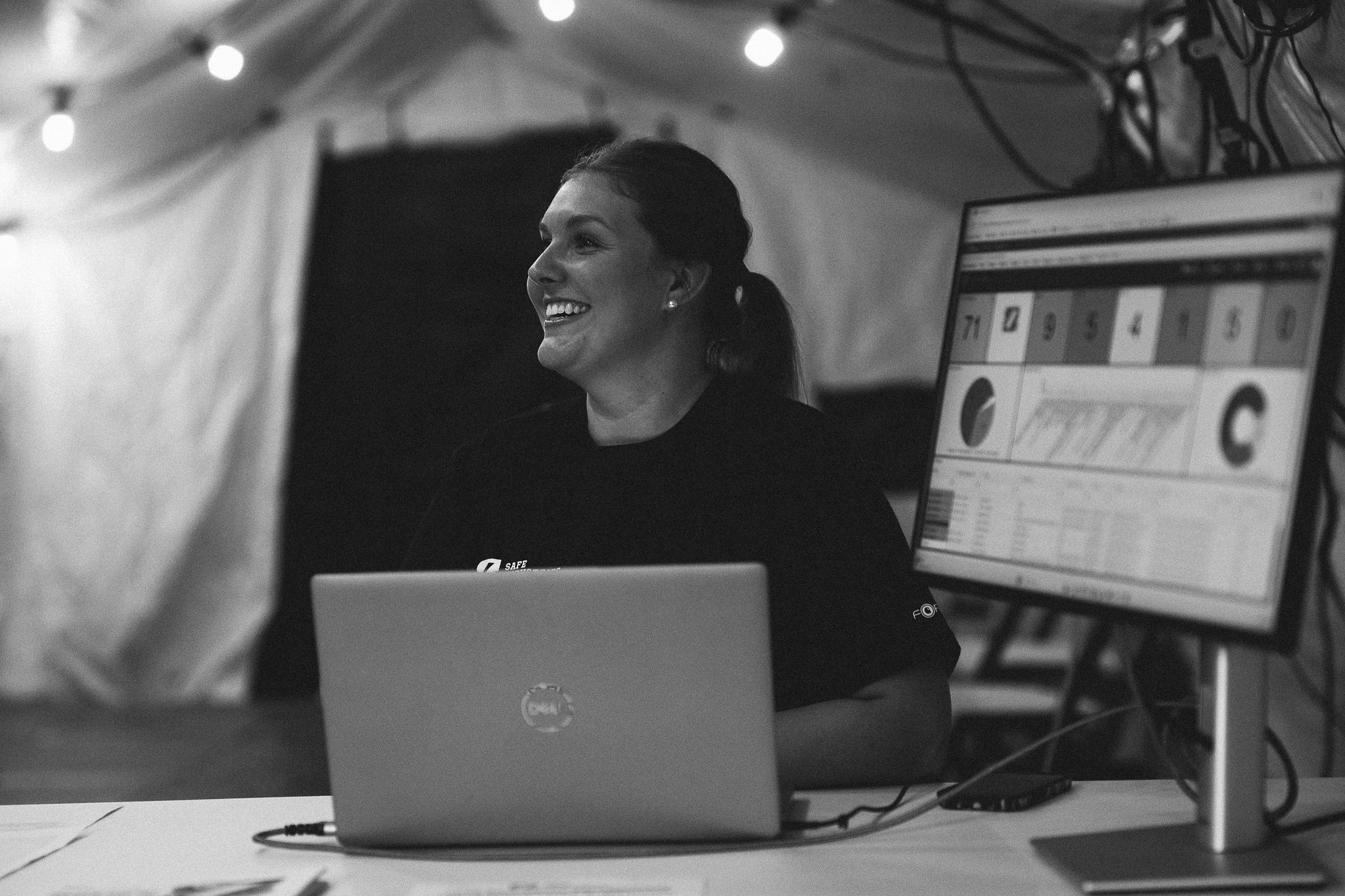 A Safe Industries teammate running numbers in a deployment command tent